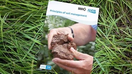 Principles of soil management publication on top of some grass